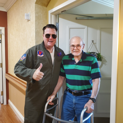Our CEO, Mike Logan, enjoying our halloween parade with an assisted living resident.