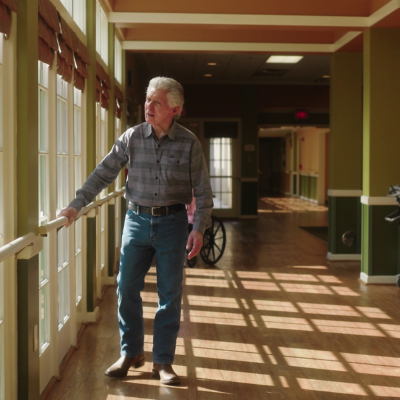Memory Center hallways and spaces are open and window-lined. Residents have plenty of space to walk around.